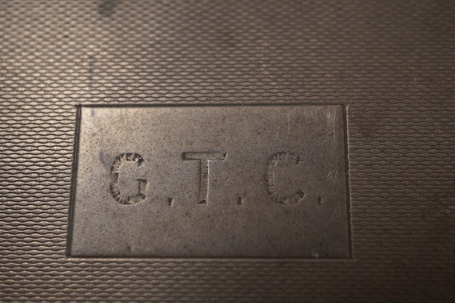 A George V engine turned silver mounted rectangular cigarette box, by William Neale Ltd, Birmingham, 1935, 16.2cm.